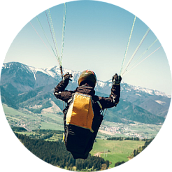 paragliding over a volcano or waterfall paragliding over a volcano or waterfall